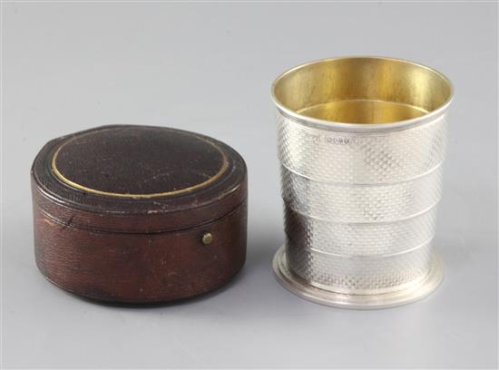 A cased Victorian engine turned silver telescopic travelling beaker, Henry William Dee, 5.8 oz.